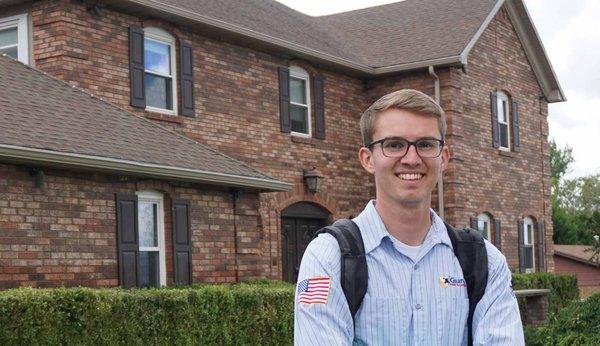 Guardian Pest Control technician standing in front of customers home