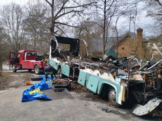 Customers call us to remove a burnt RV off his property