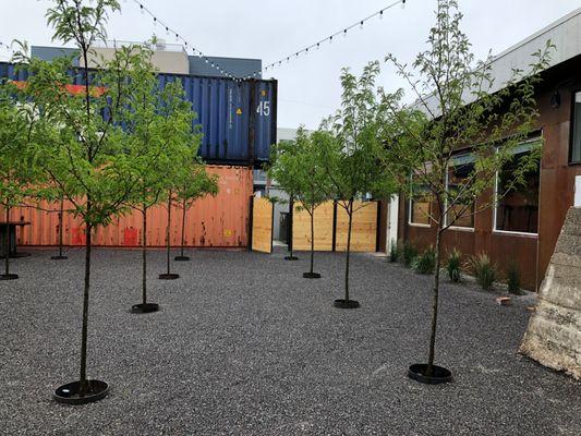 Courtyard, two sides brick, two sides containers