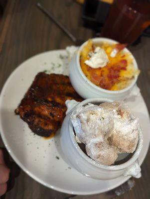 Caribbean bbq pork porterhouse with cheddar mash and corn fritters.