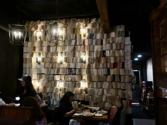 The wall of books in their smaller dining room.