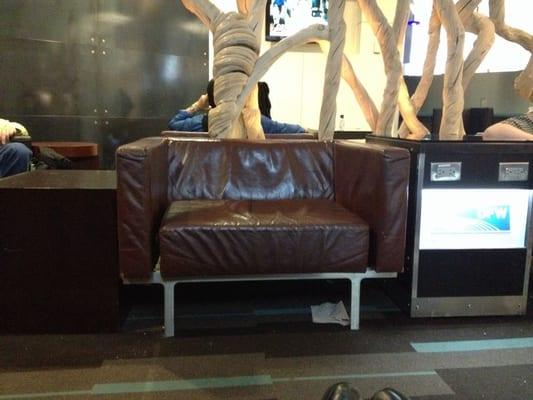 Comfortable lounge next to another nearby Starbucks with power outlets and comfortable low back leather chairs to relax in