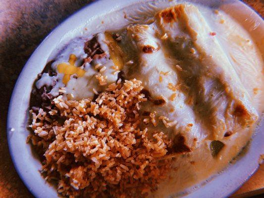 Chicken enchiladas with queso. Rice and beans.