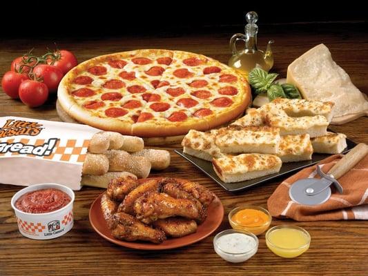 Looking an affordable, delicious dinner? Here it is! Pizza, Crazy Bread, Italian Cheesy Bread, and chicken wings!