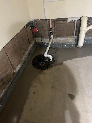 Completed interior drain and sump pump system.