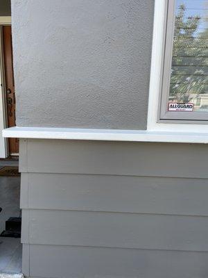 Wuall that had exterior wall insulation done. Once patched and painted. 

Both exterior materials (wood siding & stucco)