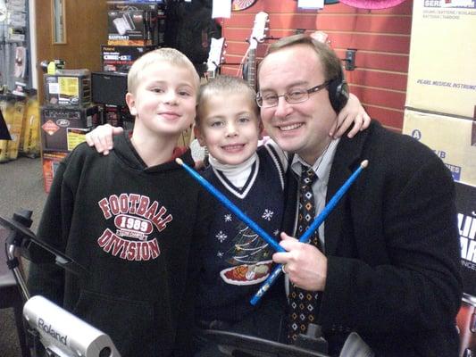 New Canaan High School Band Director Scott Cranston visits Creative Music with his two boys.