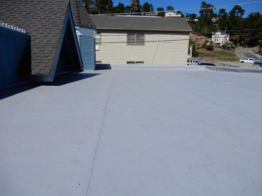 Notice the TPO covering the parapet protecting the edges as well as the entire flat roof.