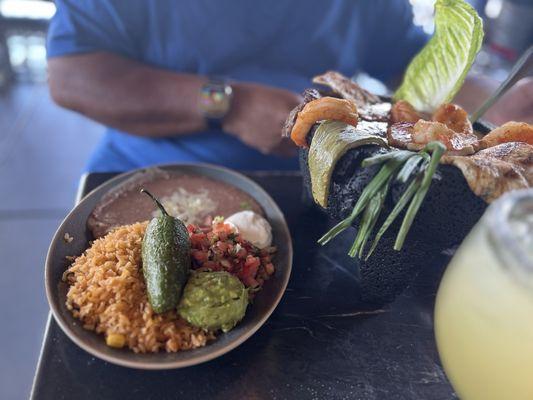 Molcajete comes with side of rice and beans