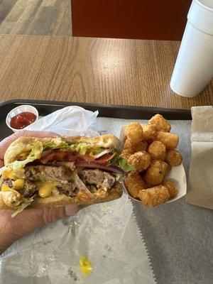 Double Cheeseburger, tater tots, and drink over $14.