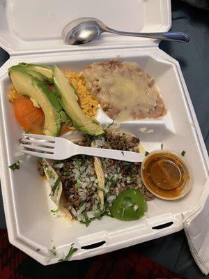 Delicious Asada Platter with Rice and Beans Avocado and Salsa