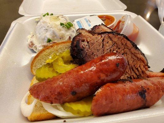 Sausage, brisket, potato salad, pickles, onions bread and bbq sauce