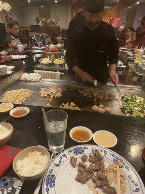 Steak, chicken, shrimp, scallops, veggies, noodles.