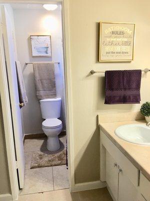 Bathroom vanity and shower/toilet is separate.