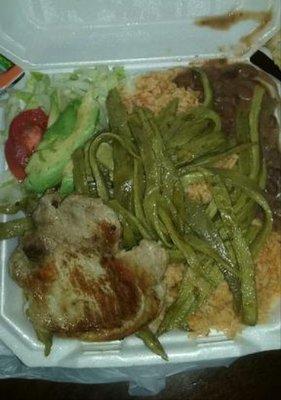 There are a total of 3or 4 thin sliced porkchops can't remember which ) with rice, beans, nopales, salad