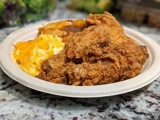 Three-piece fried chicken combo with mac 'n cheese and mashed potatoes and gravy. I asked for all dark meat. This cost $5 something.