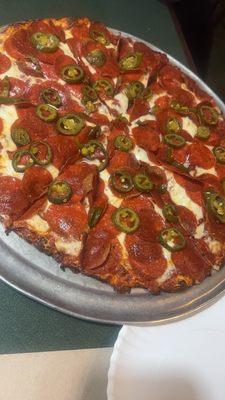 Thin crust double pepperoni pizza with jalapeños