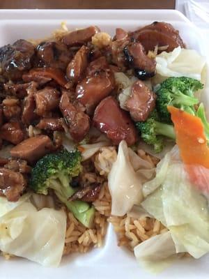 Teriyaki chicken served with veggies and rice.