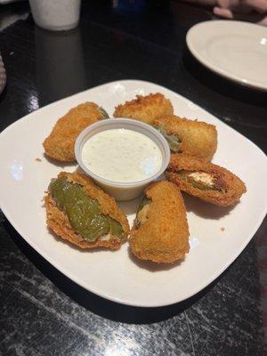 Hand breaded cream cheese jalapeño poppers