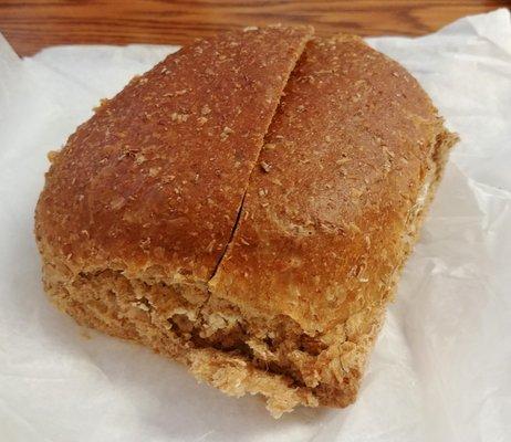 Buttered whole wheat roll.