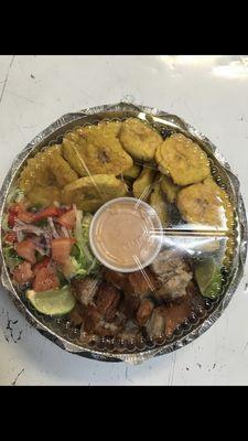 Fried green plantains and fried pork belly/tostones con chicharrón