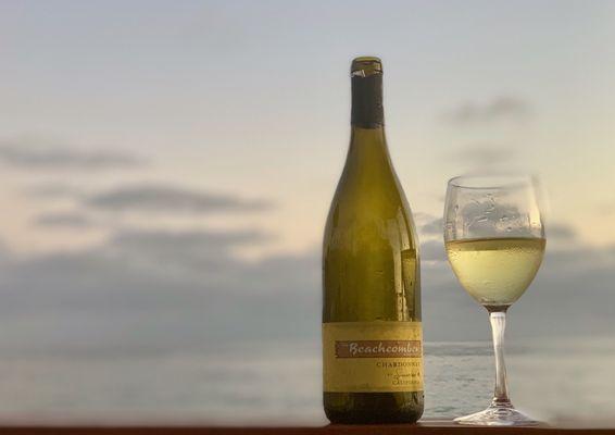 A glass of Beachcomer Chardonnay at sunset 
Photo by Kathi