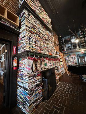 Book decorated fireplace in the center of the store.