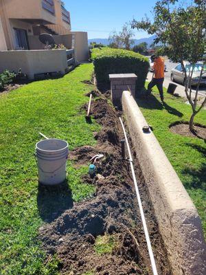 Separation of irrigation system planters from grass areas