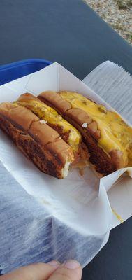 Biting into a delish coney island dog.