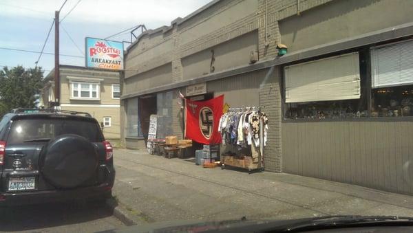 This Nazi flag was hanging outside the shop today for D-Day. Real patriots at this place. Ugh.