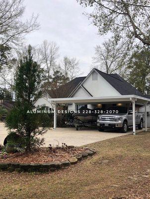 Double aluminum carport with .030 3" non insulated roof system with gutter. Large carports need  .030 thickness for strength.