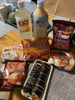 my haul with the chips, ramen, drinks, and kimbap