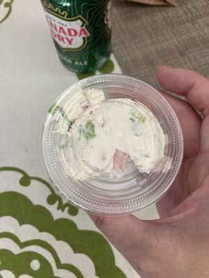 Single serve container of chive cream cheese & lox - about 1/4 cup.