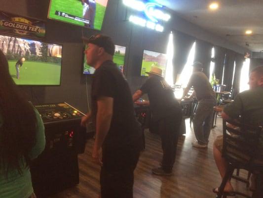 Guys playing Golden Tee