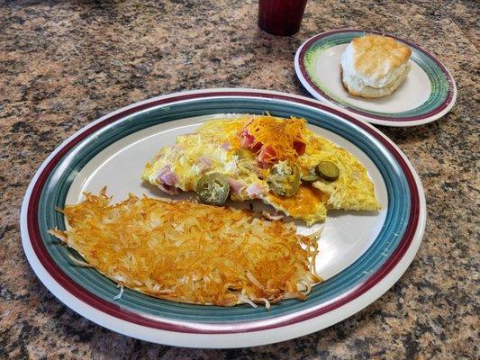 Farmer's omelet with added jalapenos and a biscuit.