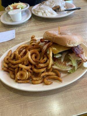 Bacon cheeseburger and curly Q fries