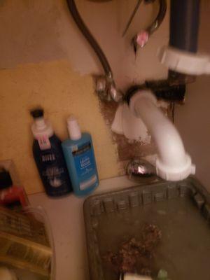 Bathroom sink shown with removal of according style pipe.