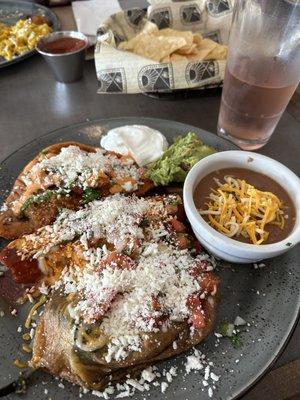 Three choices from the uno dos tres option. A tamale, an empanada, and a cheese stuffed pepper with two sides.