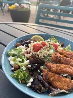 Salad topped with house made veggie patty