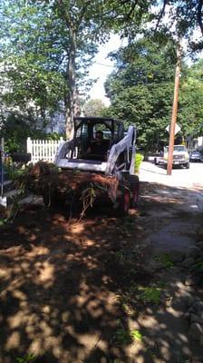 The owner hard at work replacing a families lawn.