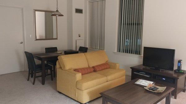 Living and dining areas in a two bedroom apartment at Oakwood