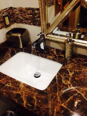 Neat faucet with lovely marble counters