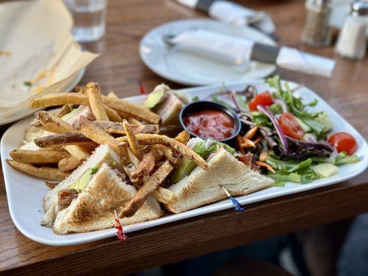 California Turkey Club - turkey, smoked applewood bacon, avocado, cranberry mayo, on toasted Texas white bread, served with fries and salad