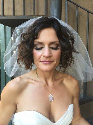 Nikki's wedding makeup application has a smokey eye, with a smudge eyeliner, for a soft look.