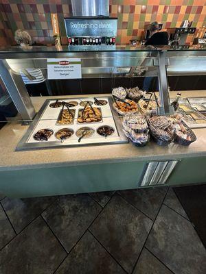 Part of salad bar - muffins, crackers and dried toppings. I really like the garlic toast pieces.