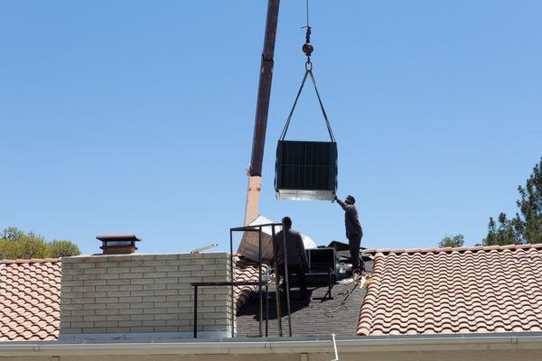 Placing the unit on the new supports and curbing.