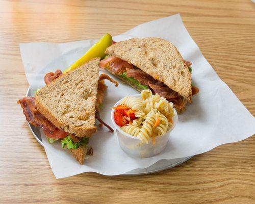 BLT. Apple wood smoked thick cut bacon, leaf lettuce, tomato choice of bread and one side with pickle.