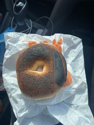 A "toasted" plain bagel with cream cheese