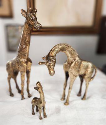 Family of brass giraffes.