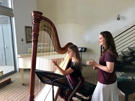 Working on harmonics at a harp lesson.